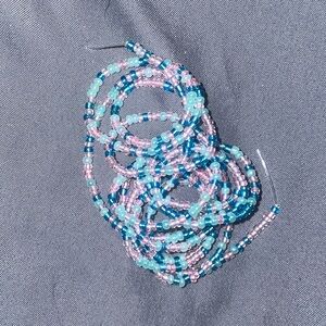 Glass seed beads. Waist bead in cotton candy colors .